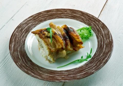 Baked cod wrapped in bacon Stock Photos