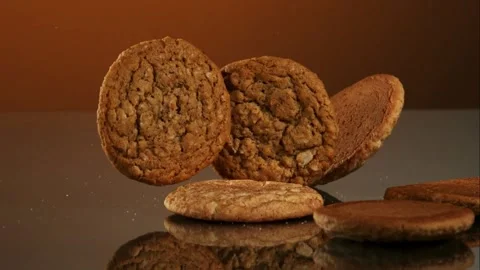 Baked cookies fall and stack in studio Stock Footage 326754665