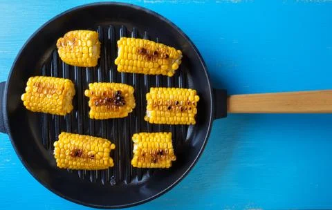 Baked corn in a frying pan Stock Photos