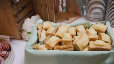 Baked cornbread on serving tray for event catering in slo mo Stock Footage 310750971