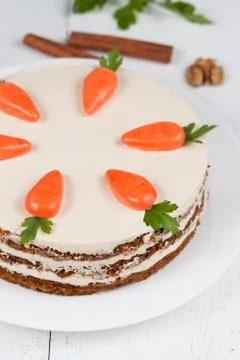 Baked easter carrot cake with icing and little carrots on top Stock Photos