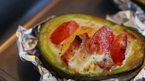 Baked Eggs in Avocado Stock Footage 74595609