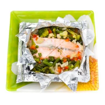 Baked Fillet of Fish in Foil with Vegetables Stock Photos