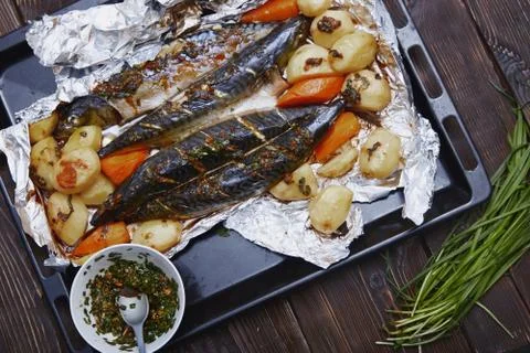 Baked fish and vegetable Stock Photos