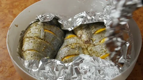 Baked Fish In Foil Stock Footage 146470724