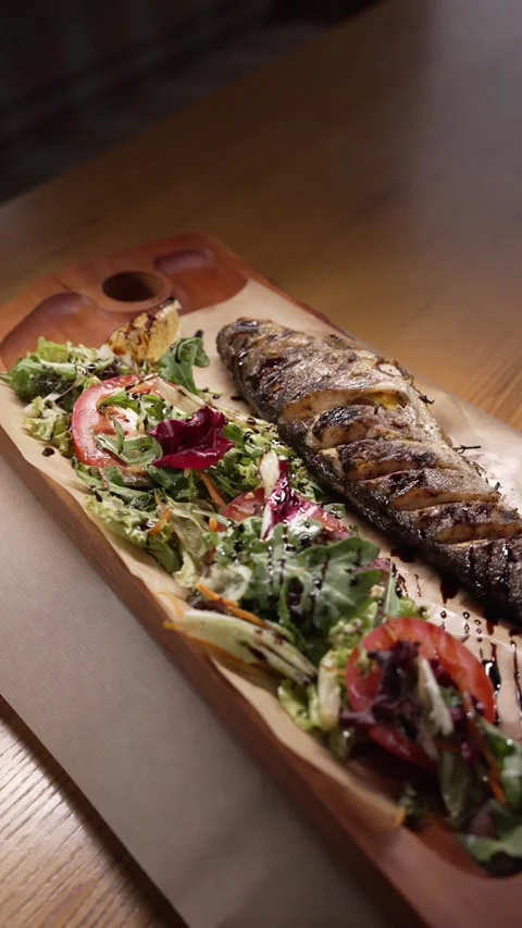 Baked fish with grilled vegetables Stock Footage 220065454