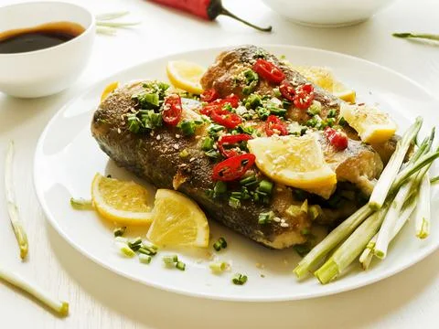 Baked hake fish Stock Photos