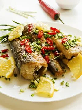 Baked hake fish Stock Photos