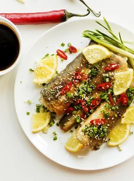 Baked hake fish Stock Photos