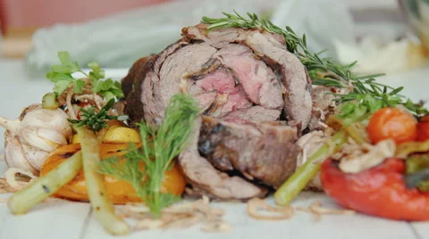 Baked ham in vegetables Stock Footage 60687910