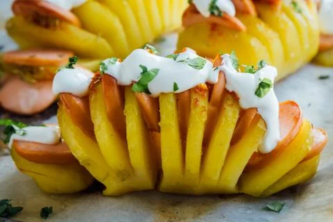 Baked hasselback potatoes Stock Photos