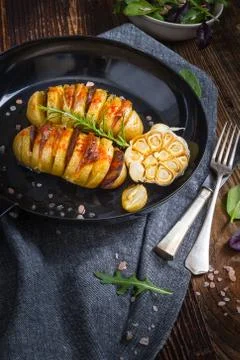 Baked hasselback potatoes. Fotos Stock