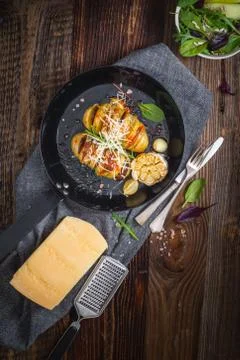 Baked hasselback potatoes. Stock Photos