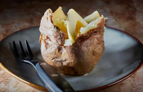 Baked jacket potato. Stock Photos