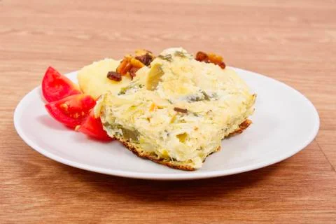 Baked leek with mashed potatoes on a table Stock Photos