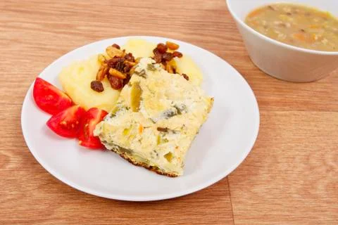Baked leek with mashed potatoes on a table Stock Photos