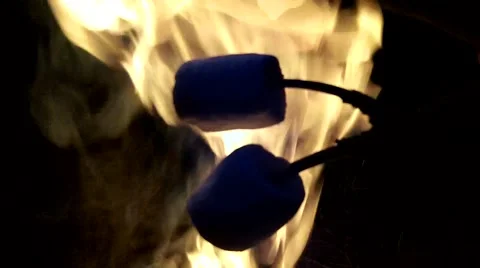 Baked marshmallows over a campfire Stock Footage 50367752