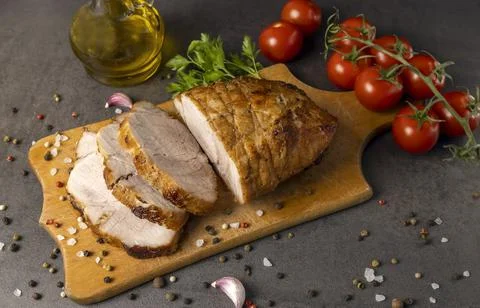 Baked meat with a crispy appetizing crust. Stock Photos