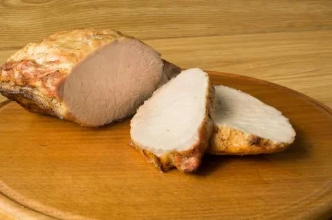 Baked meat is cut for the portion. Stock Photos