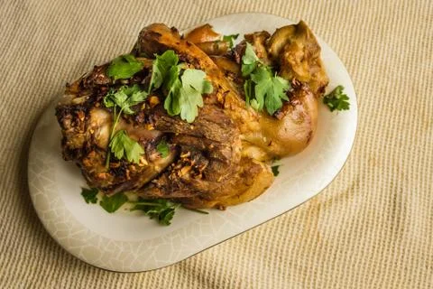Baked meat on the kitchen table. Stock Photos