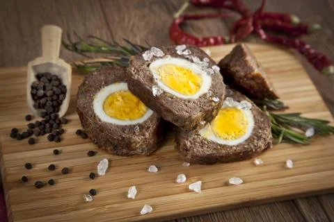 Baked meatloaf with boiled eggs for easter Stock Photos