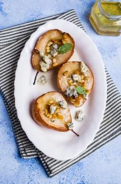 Baked pears with nuts Stock Photos