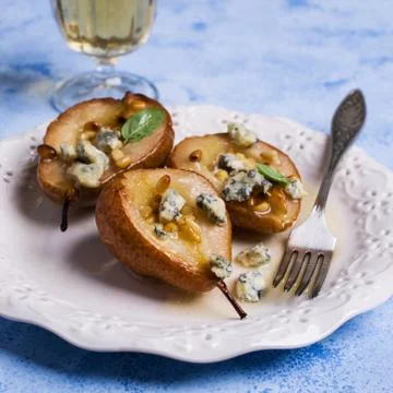 Baked pears with nuts Stock Photos