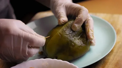 Baked pepper basket. I prepare Mexican Stuffed Poblano Peppers in Walnut Sauce Stock Footage 157783860