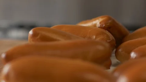 Baked pies on lying on dish in bakery shop close up. Appetizing hot patties Stock Footage 90807184