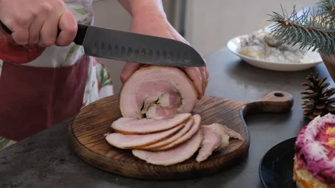Baked pork belly. The cutting process. Preparing for the holiday. Christmas. Stock Footage 344719246