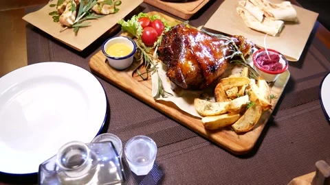 Baked pork knee. Fried beef liver with onions. Horseradish vodka and pork knee. Vídeos de archivo 139278980