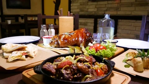 Baked pork knee. Fried beef liver with onions. Horseradish vodka and pork knee. Stock Footage 139279291