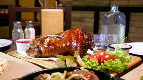 Baked pork knee. Fried beef liver with onions. Horseradish vodka and pork knee. Stock Footage 139279417