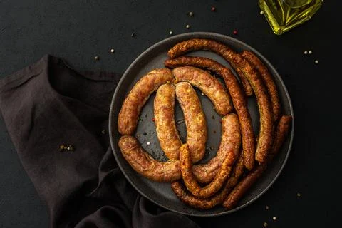 Baked pork sausages with spices Stock Photos
