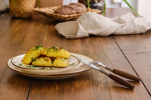 Baked potato served for dinner on a table Stock Photos