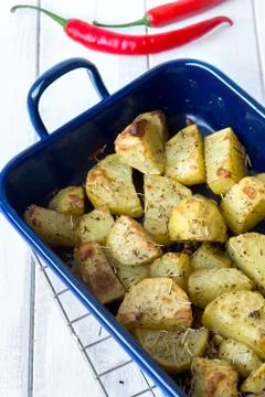 Baked potatoes in a pan Stock Photos