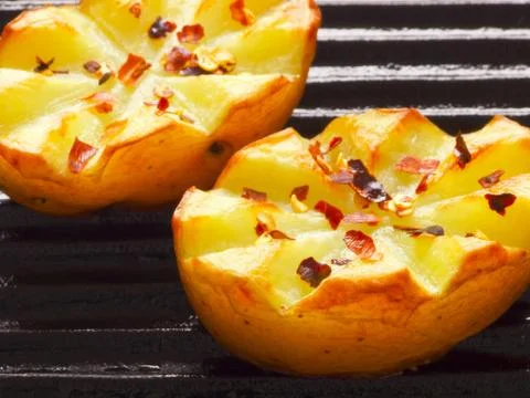 Baked potatoes Stock Photos