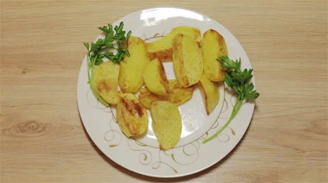 Baked potatoes in the plate Stock Footage 62554572