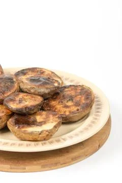 Baked potatoes in the shell isolated over white Stock Photos