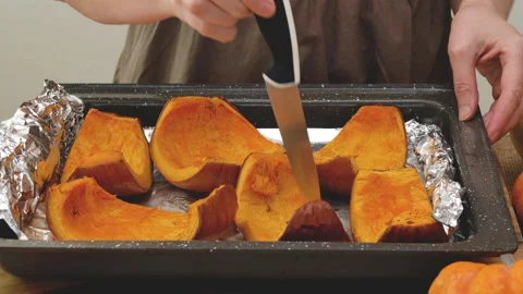 Baked pumpkin slices close up on baking pan Stock Footage 160427277