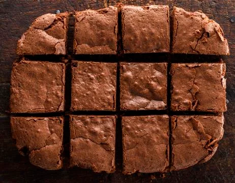 A baked rectangular chocolate brownie pie is cut into squares Stock Photos