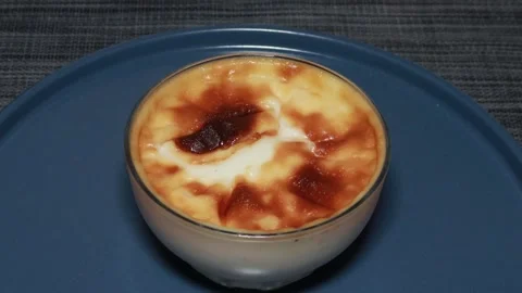 Baked rice pudding with Turkish dessert fresh burn rotates 360 degrees, 4k Stock Footage 248616909