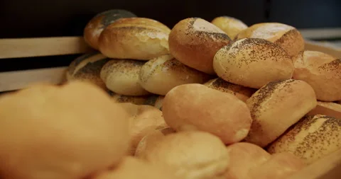 Baked rolls at a bakery 4K. Stock Footage 221559468