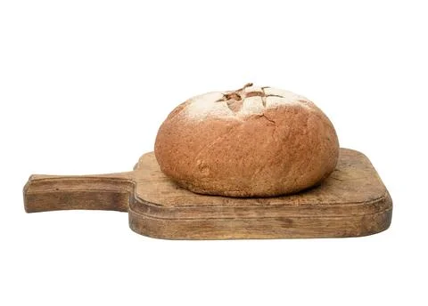 Baked round rye flour bread on brown wooden board, loaf of bread isolated 스톡 사진