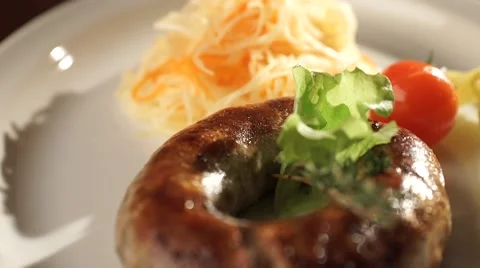 Baked sausage with garnish Stock Footage 47564837