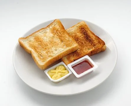 Baked slices of bread with jam and butter Stock Photos