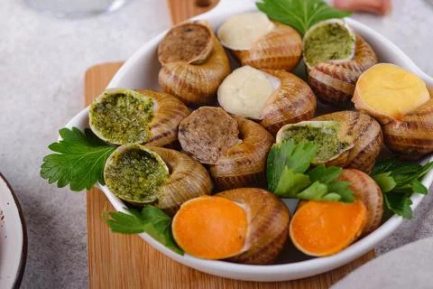 Baked snails Escargot with bread Stock Photos