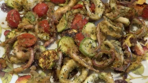 Baked squid with zucchini and cherry tomatoes Stock Footage 235656208