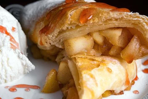 Baked strudel with apple, jam and ice cream Stock Photos