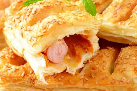 Baked stuffed bread with sausage inside Stock Photos